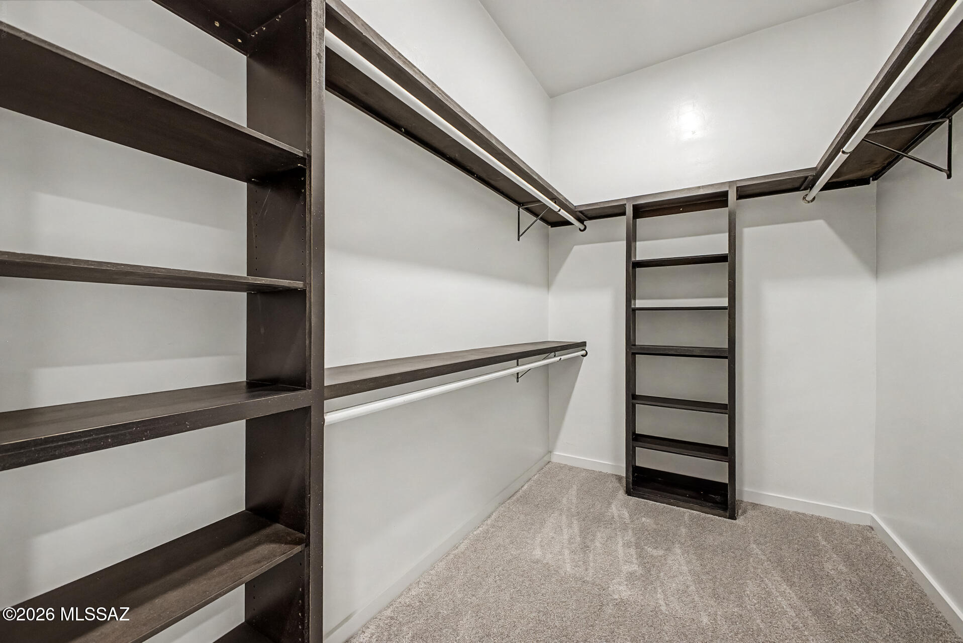 2399 Della Roccia Court Tucson, AZ 85737 - Photo 21 of 34 a view of walk in closet with empty racks
