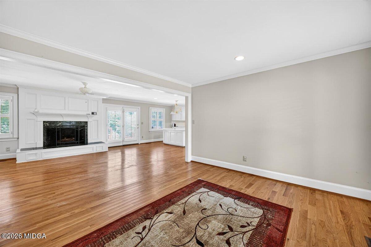 335 Hamrick Road Macon, GA 31220 - Photo 7 of 41 a view of an empty room with wooden floor and a fireplace