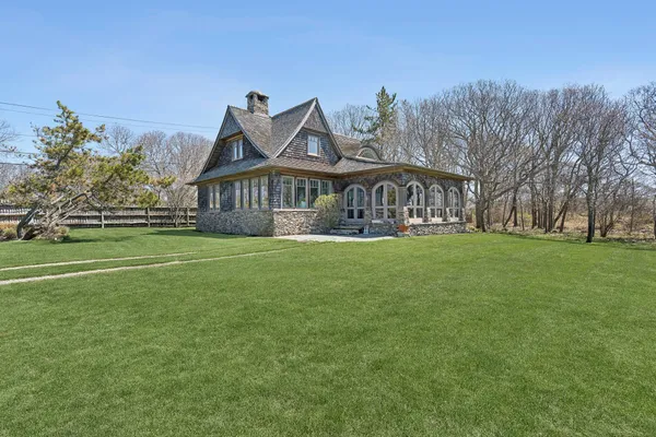 a front view of house with yard and green space