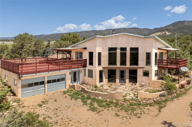front view of a house with a large yard