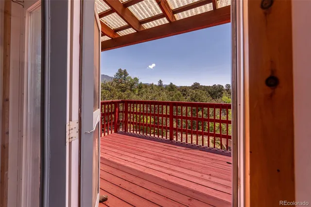 a view of balcony with wooden floor