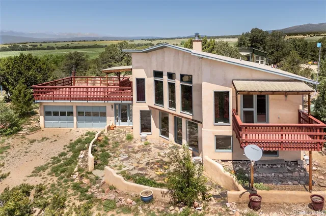 a backyard of a house with wooden fence