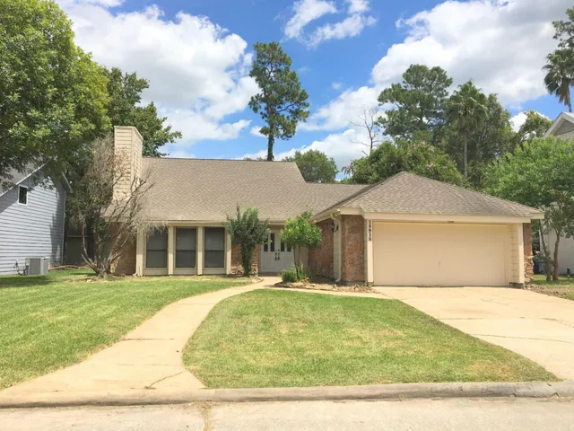 a view of a white house with a outdoor space