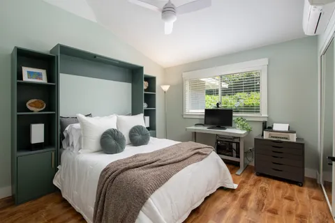 a bedroom with a bed and a table