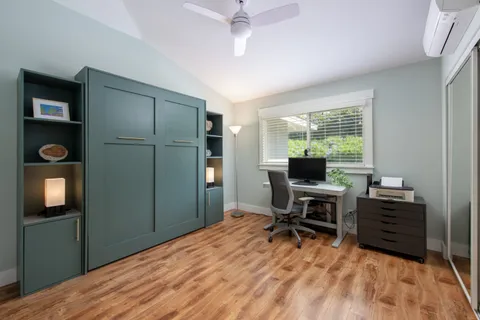 a workspace with furniture and window