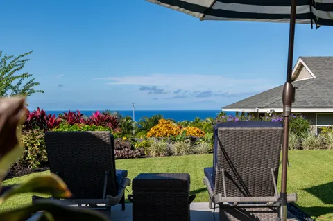 a view of a chairs and table in a patio