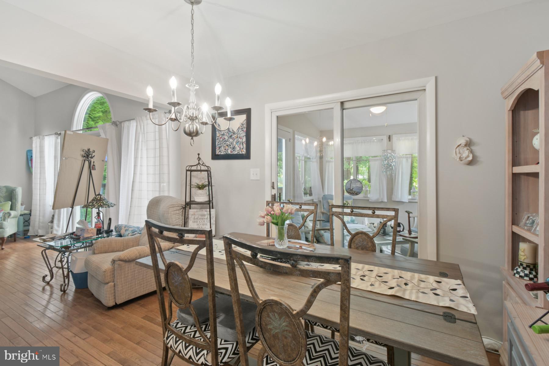 44 Beaconhill Road Ocean Pines, MD 21811 - Photo 11 of 28 a dining room with furniture a chandelier and wooden floor