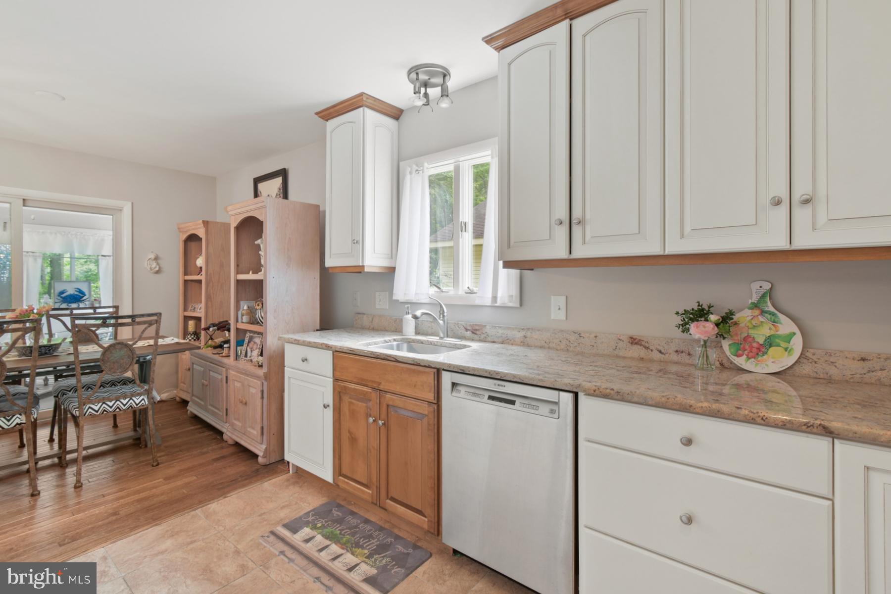 44 Beaconhill Road Ocean Pines, MD 21811 - Photo 12 of 28 a kitchen with a sink window and cabinets