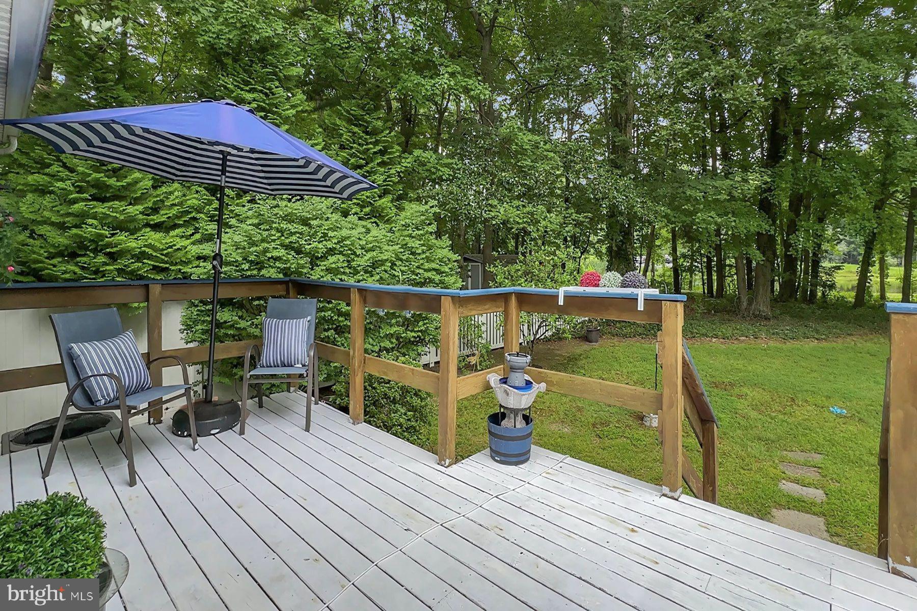 44 Beaconhill Road Ocean Pines, MD 21811 - Photo 3 of 28 a view of a wooden deck with furniture