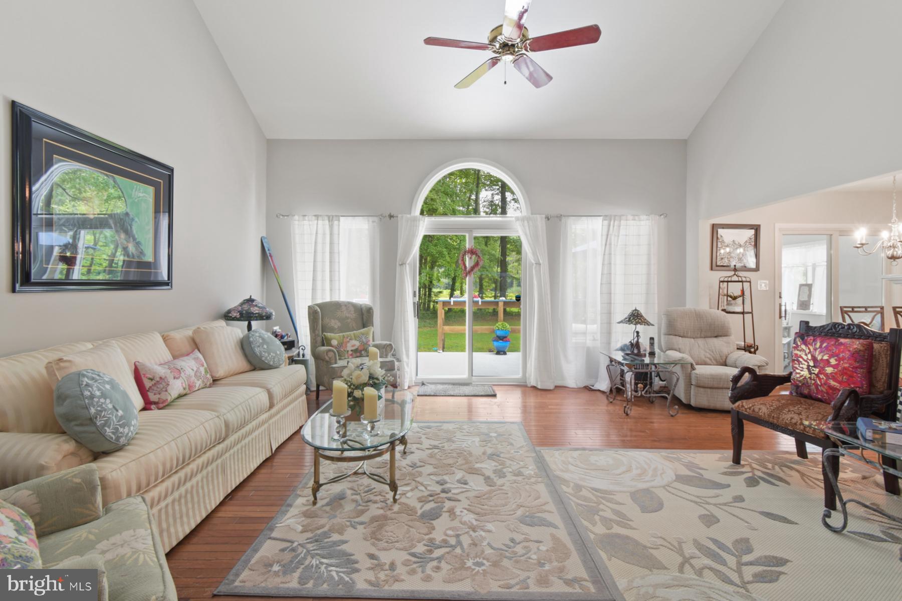 44 Beaconhill Road Ocean Pines, MD 21811 - Photo 9 of 28 a living room with furniture a chandelier and a window