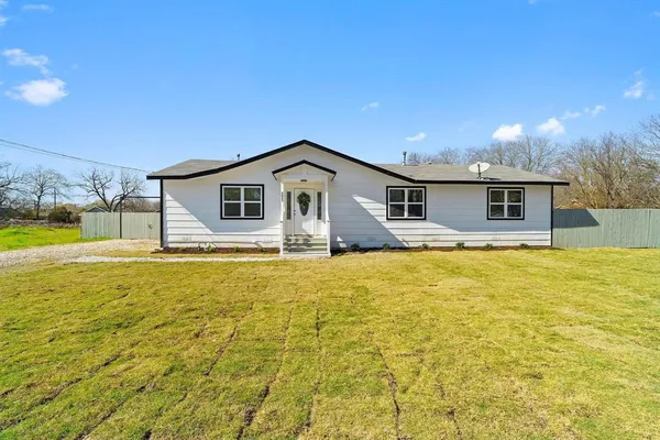 a front view of a house with swimming pool