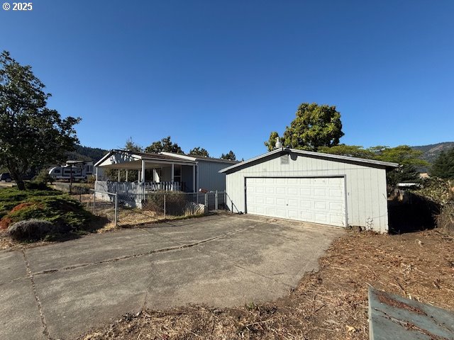 903 Cook Street Myrtle Creek, OR 97457 - Photo 2 of 20 a view of a house with a snow in the yard