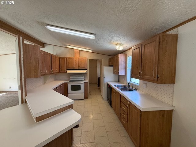 903 Cook Street Myrtle Creek, OR 97457 - Photo 6 of 20 a kitchen with stainless steel appliances a sink a stove a microwave and cabinets