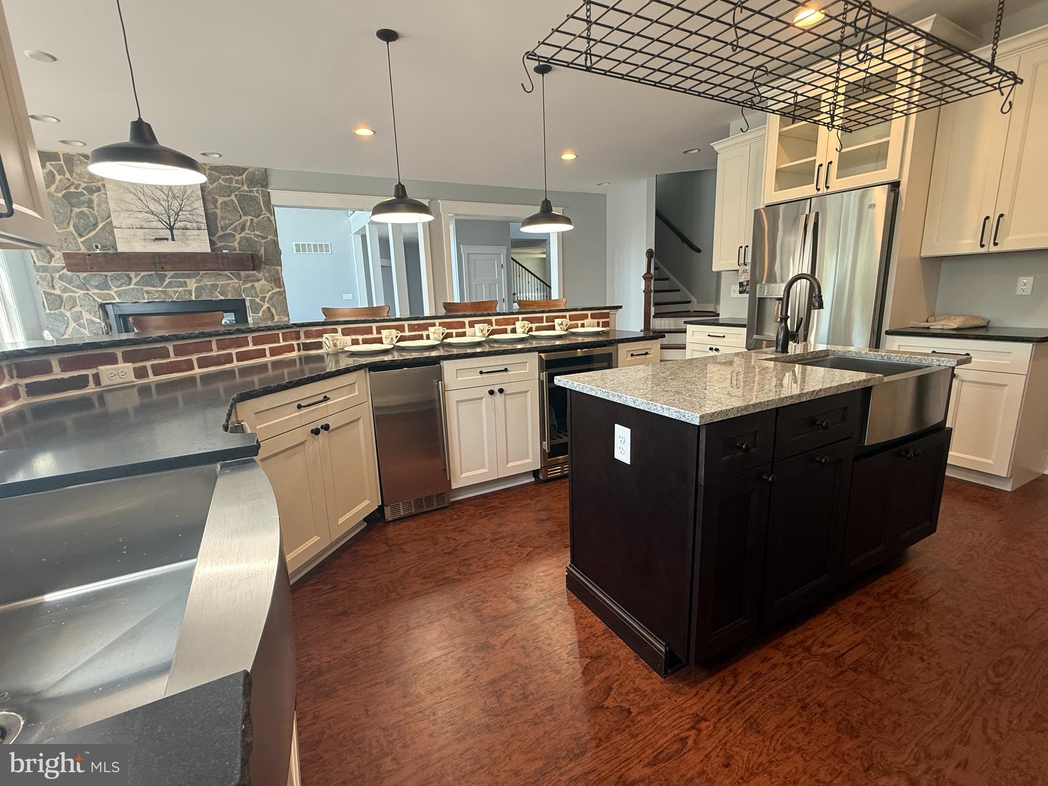 5482 Summit Bridge Road Townsend, DE 19734 - Photo 14 of 43 a kitchen with kitchen island granite countertop a sink counter top space and appliances