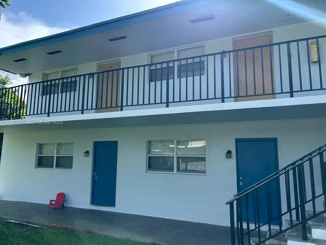 a view of staircase with wooden floor