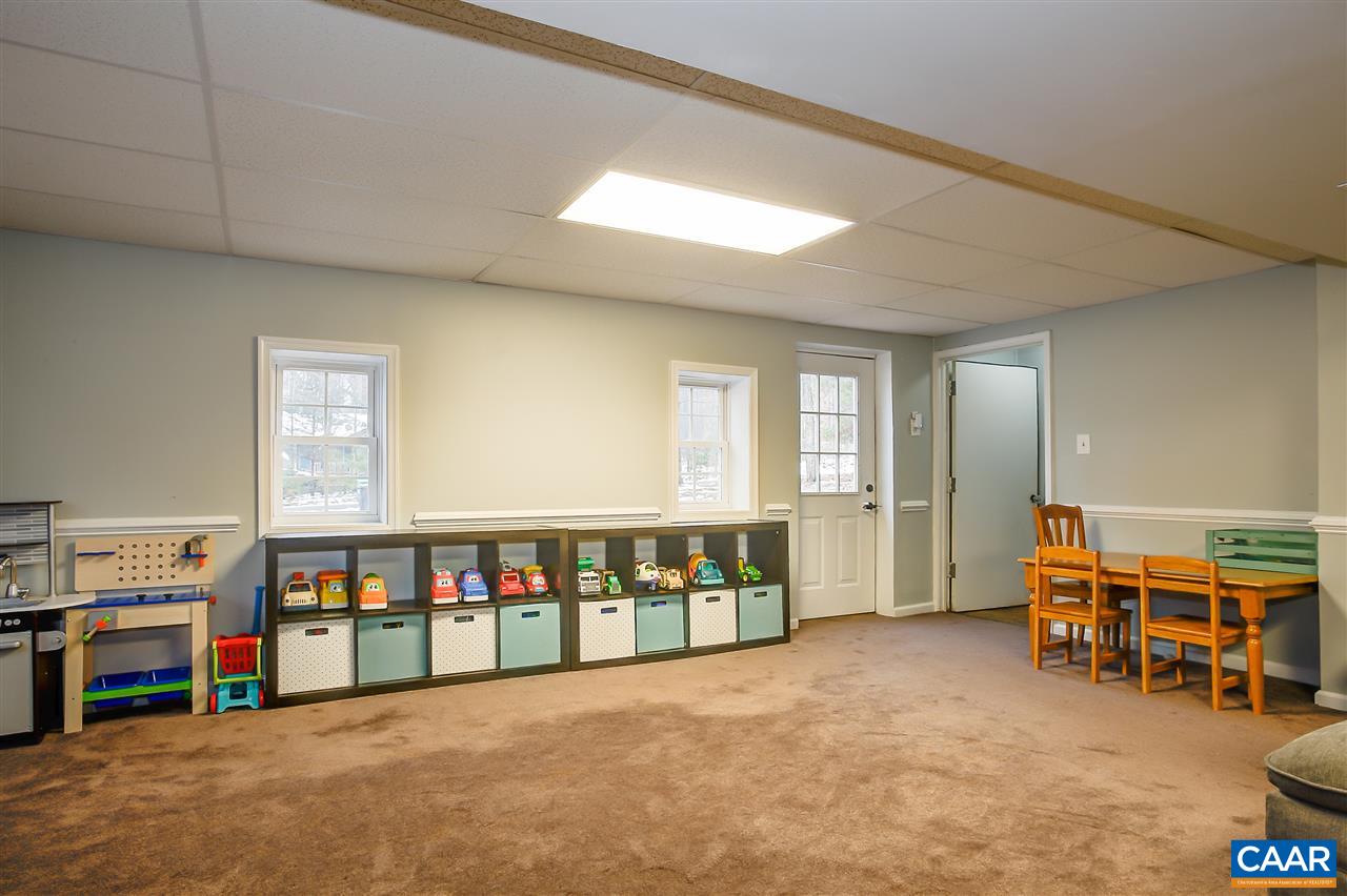 1 Dogleg Road Palmyra, VA 22963 - Photo 18 of 19 a living room with furniture and a flat screen tv