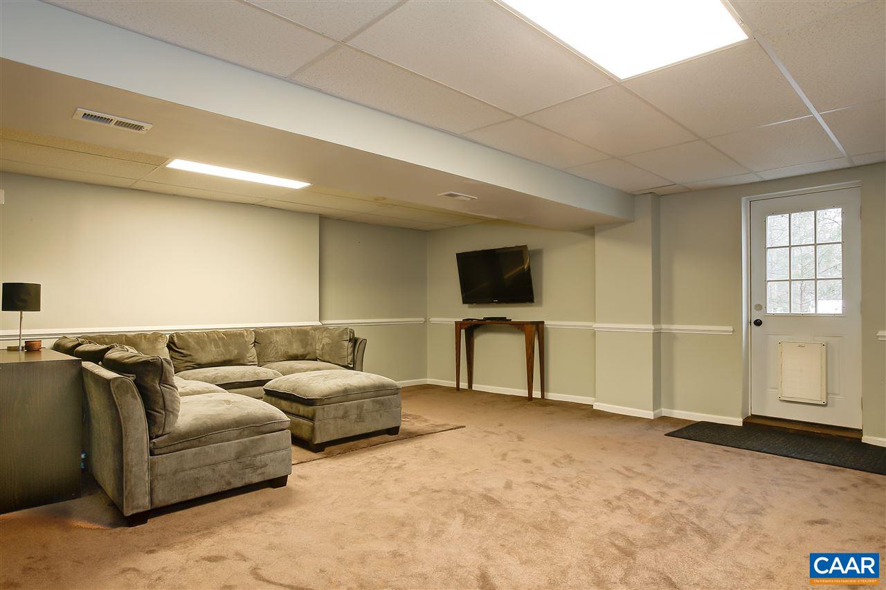 1 Dogleg Road Palmyra, VA 22963 - Photo 19 of 19 a living room with furniture and a flat screen tv