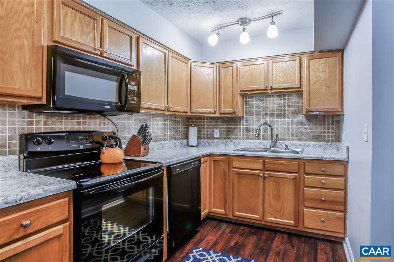 1 Dogleg Road Palmyra, VA 22963 - Photo 3 of 19 a kitchen with stainless steel appliances granite countertop a stove sink microwave and cabinets