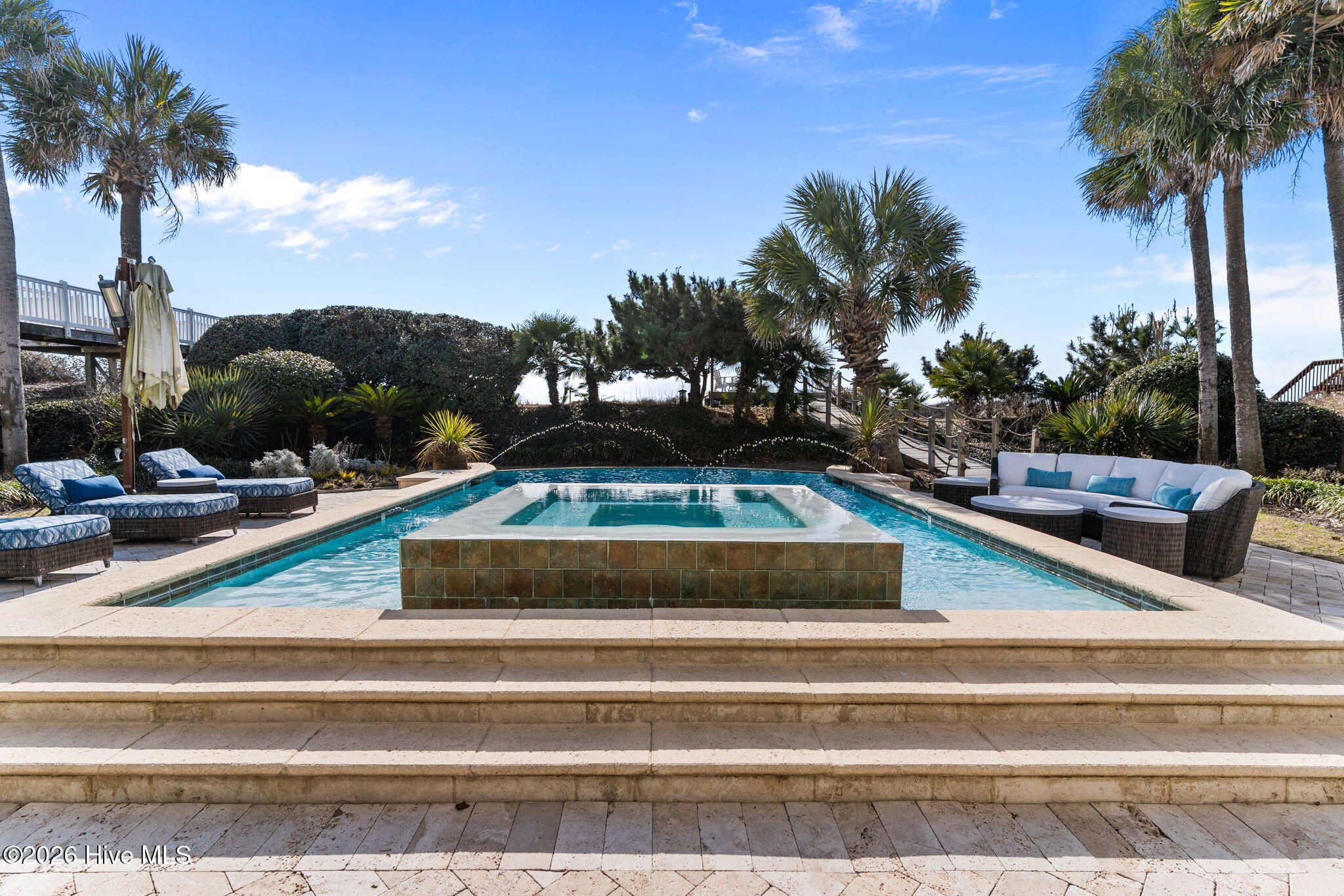 241 West First Street Ocean Isle Beach, NC 28469 - Photo 98 of 124 Large swimming pool with hot tub. Notice the size and scale- this home sits on 1.5 oceanfront lots.