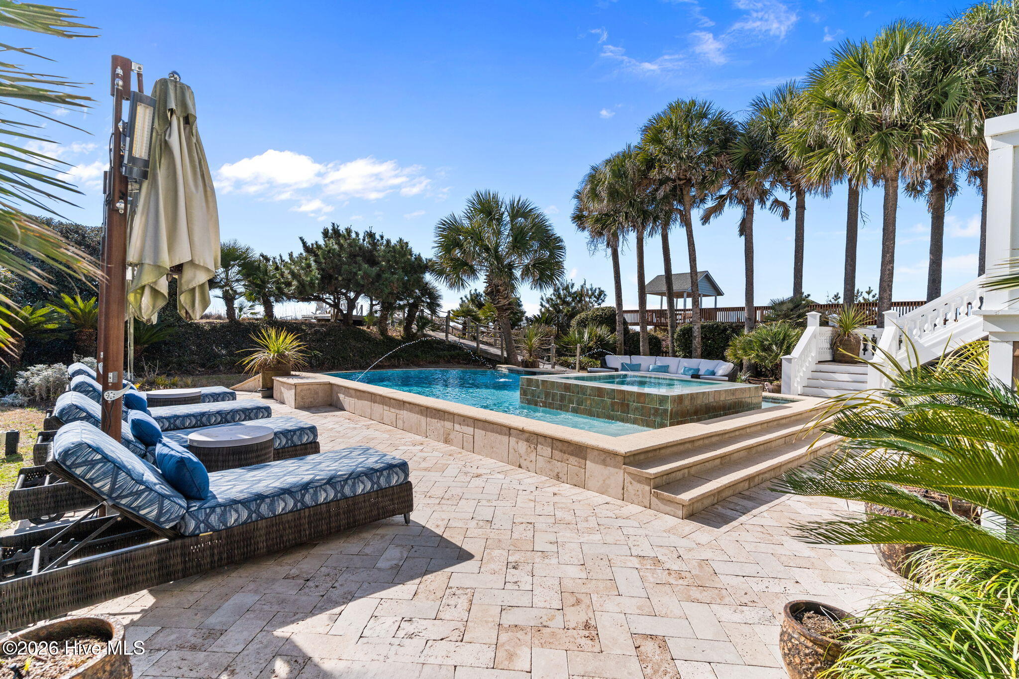 241 West First Street Ocean Isle Beach, NC 28469 - Photo 104 of 124 Plenty of seating around the large pool/hot tub.