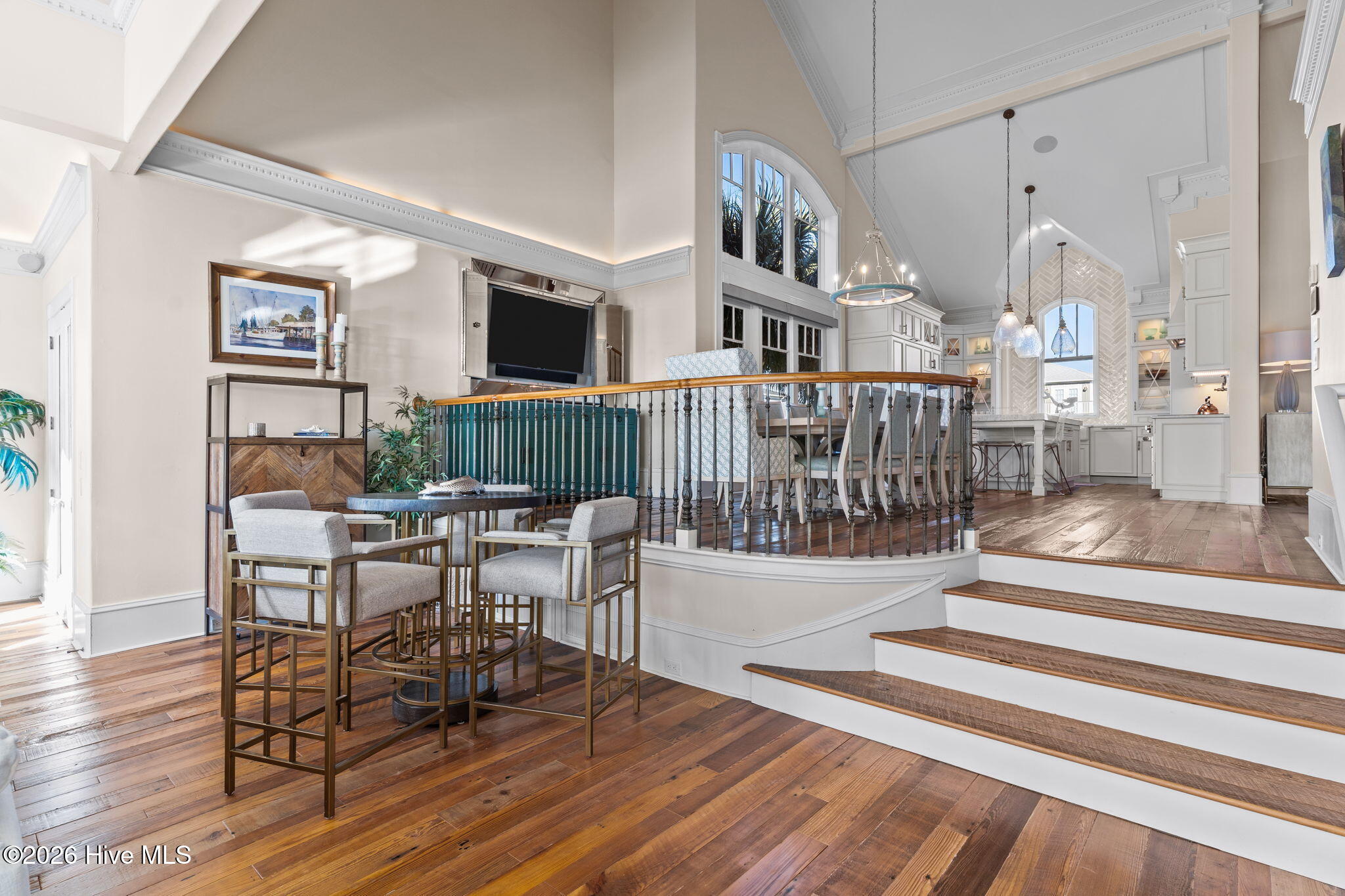 241 West First Street Ocean Isle Beach, NC 28469 - Photo 19 of 124 Space leading from living room to dining room and kitchen.