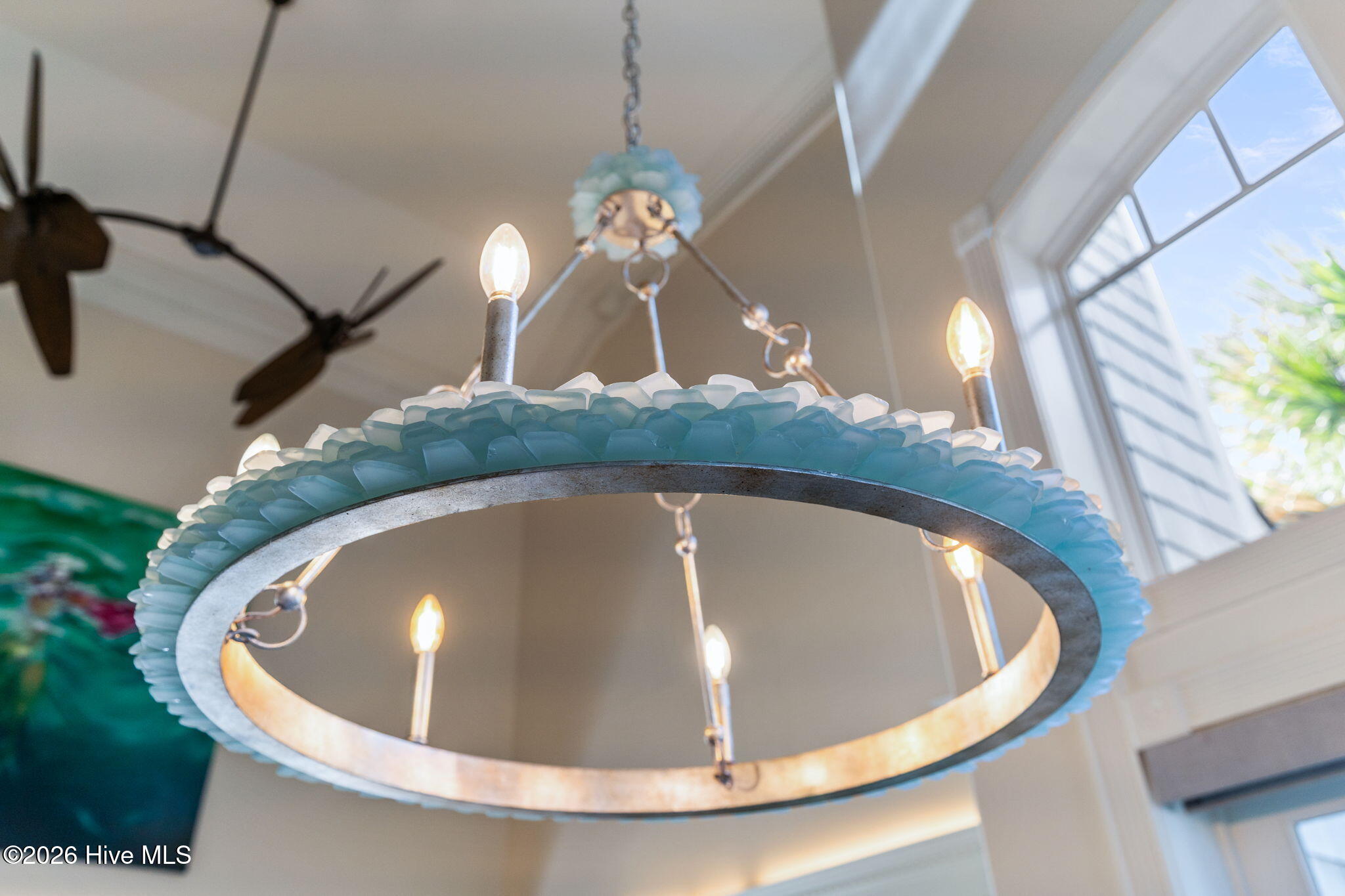 241 West First Street Ocean Isle Beach, NC 28469 - Photo 24 of 124 Seaglass chandelier above dining room table.