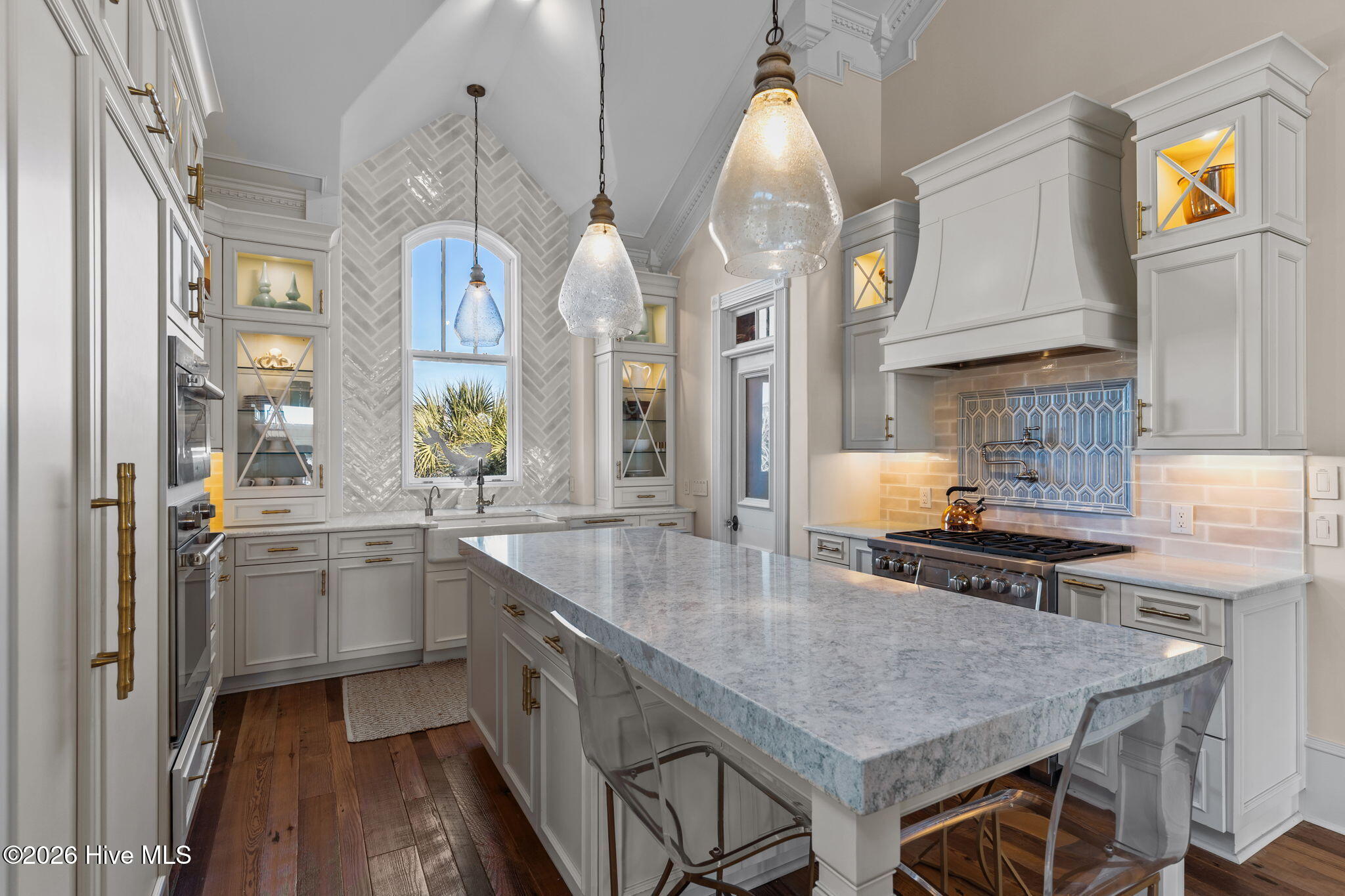 241 West First Street Ocean Isle Beach, NC 28469 - Photo 30 of 124 Custom cabinetry throughout. Tons of storage throughout kitchen with slide out drawers.