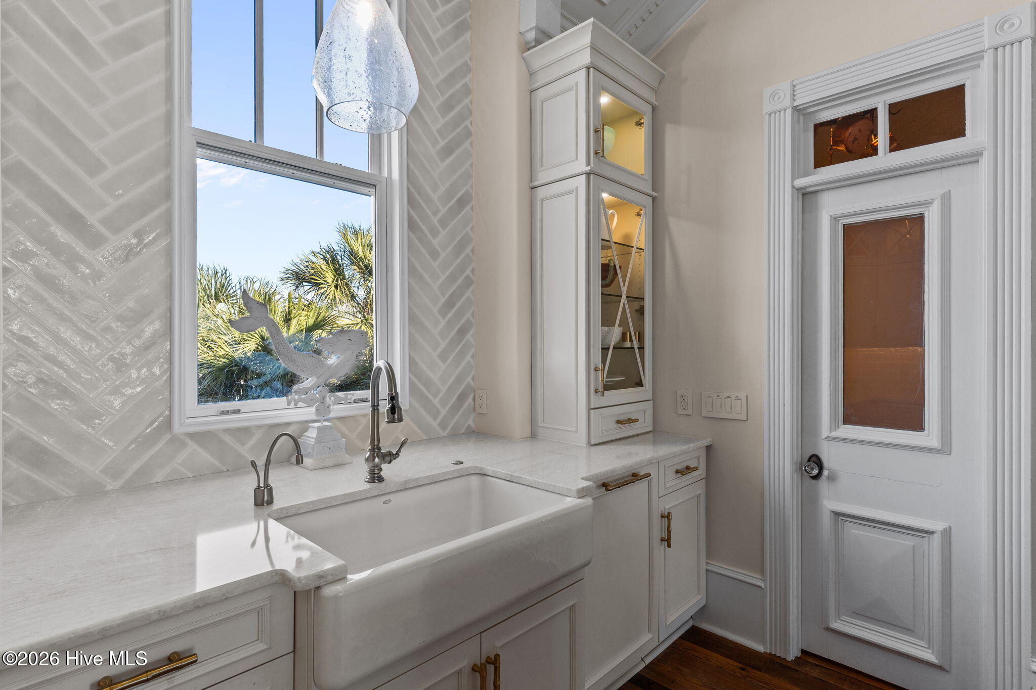 241 West First Street Ocean Isle Beach, NC 28469 - Photo 32 of 124 Tile framed kitchen window.