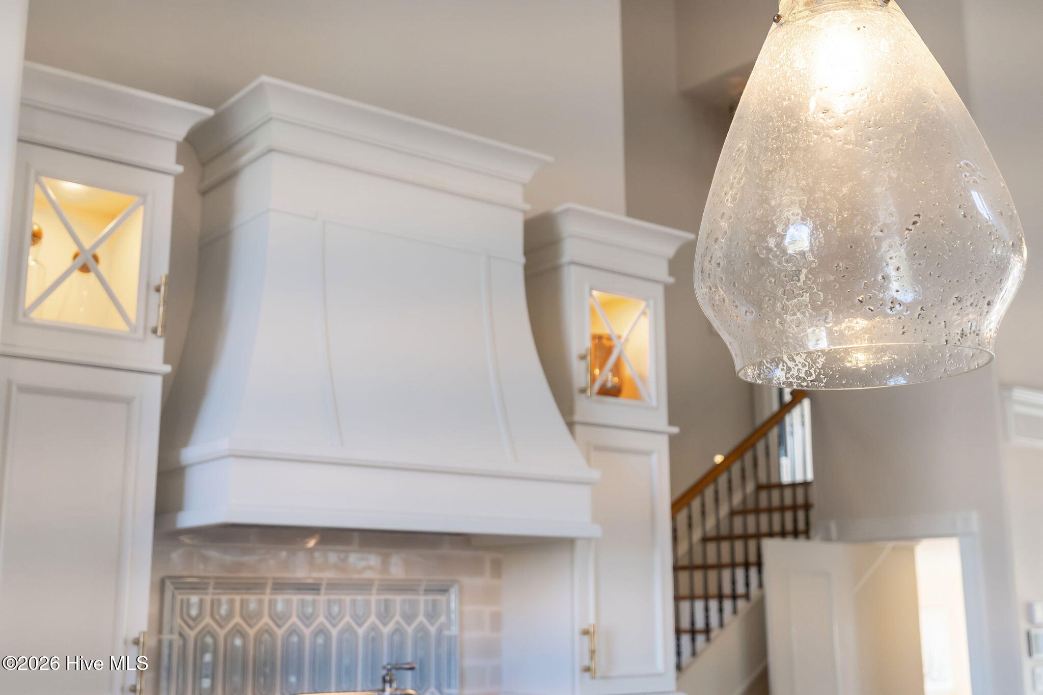 241 West First Street Ocean Isle Beach, NC 28469 - Photo 36 of 124 Stunning pendant lighting in the kitchen.