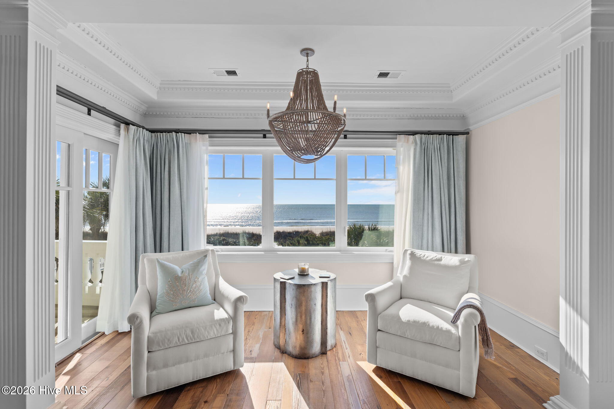 241 West First Street Ocean Isle Beach, NC 28469 - Photo 50 of 124 Primary suite bedroom overlooks the ocean.