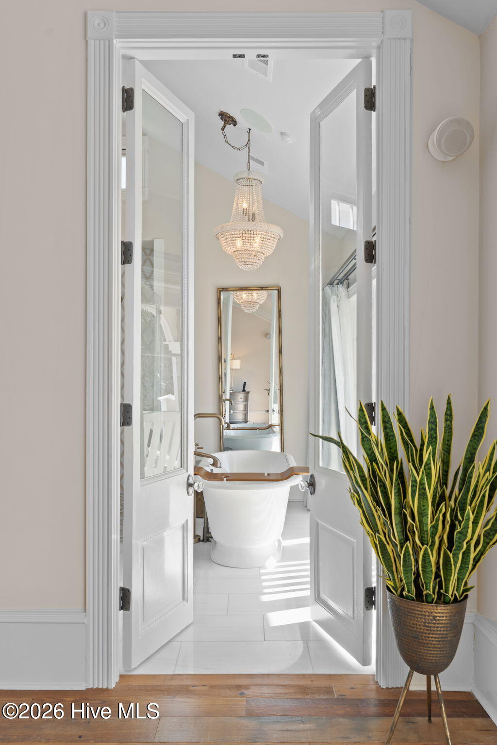 241 West First Street Ocean Isle Beach, NC 28469 - Photo 54 of 124 Primary bedroom en suite. Beautiful antique doors.