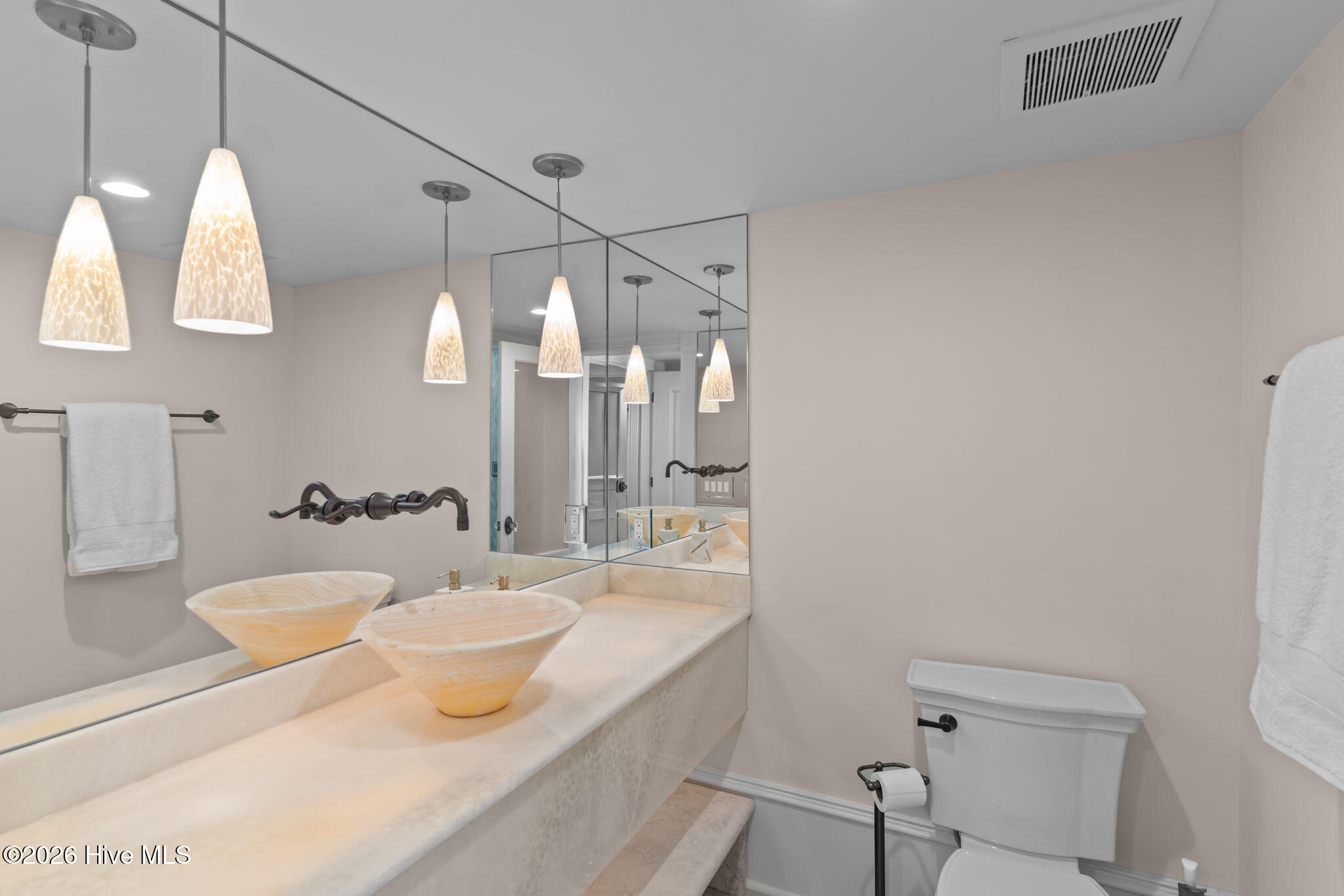 241 West First Street Ocean Isle Beach, NC 28469 - Photo 72 of 124 Bedroom 2 en suite bathroom with quartz vanity, pendant lighting and steam shower.