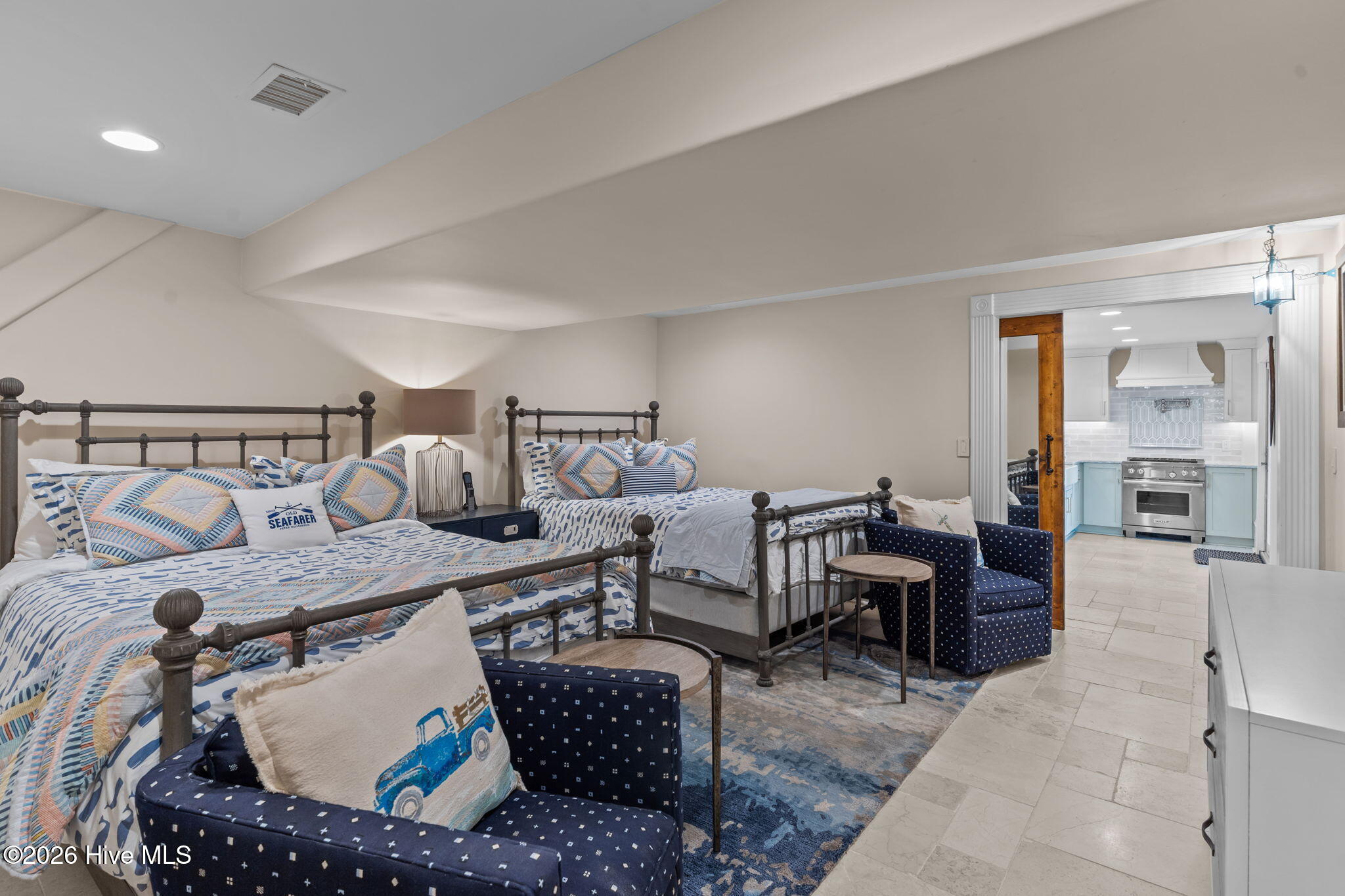 241 West First Street Ocean Isle Beach, NC 28469 - Photo 82 of 124 Ground floor bedroom 4 with tile flooring.