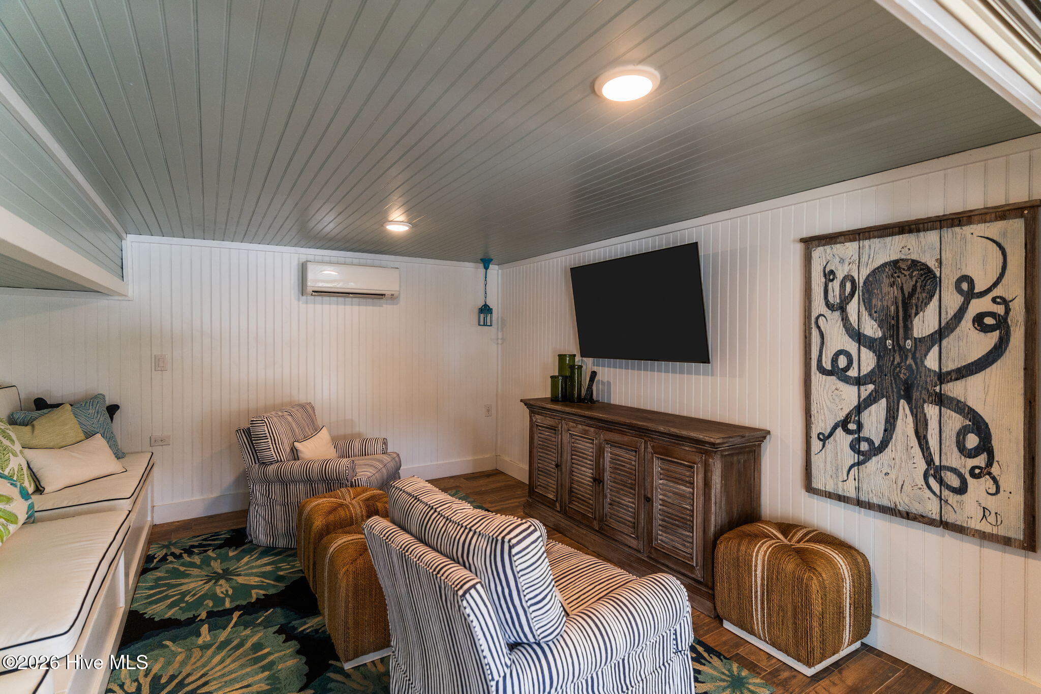 241 West First Street Ocean Isle Beach, NC 28469 - Photo 89 of 124 Cabana room accessible from outdoors. Beadboard ceiling, mini split and plenty of storage under the custom-made bench seating.