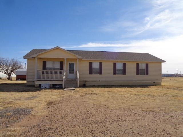 1500 5th Street Ralls, TX 79357 - Photo 1 of 10 a house with yard in front of it
