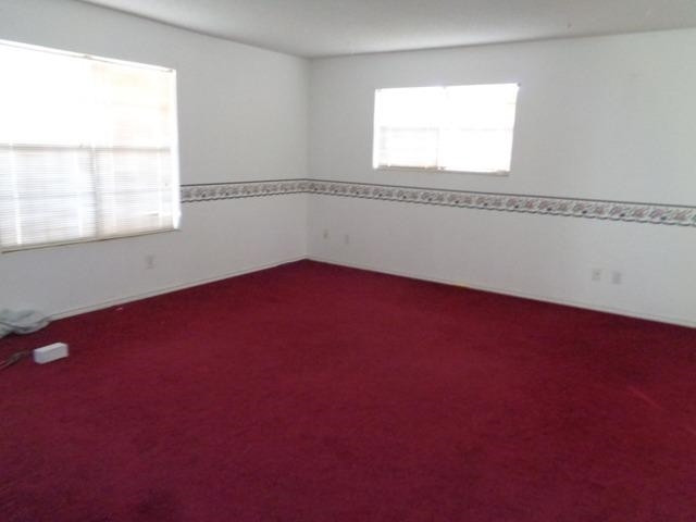 1500 5th Street Ralls, TX 79357 - Photo 2 of 10 an empty room with a window