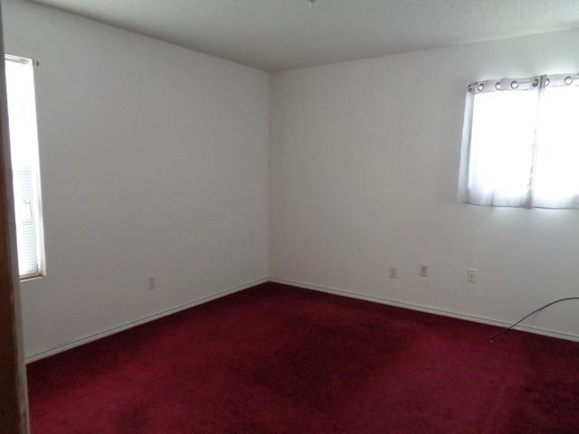1500 5th Street Ralls, TX 79357 - Photo 5 of 10 an empty room with a window