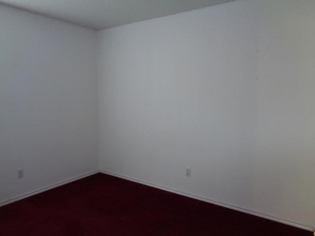 1500 5th Street Ralls, TX 79357 - Photo 7 of 10 a view of an empty room with wooden floor