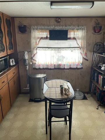 a kitchen with a stove and cabinets