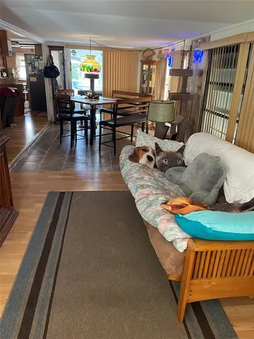 a living room with furniture a rug and a table