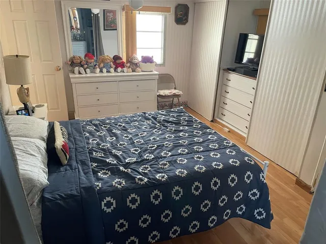 a bedroom with a bed and a dresser