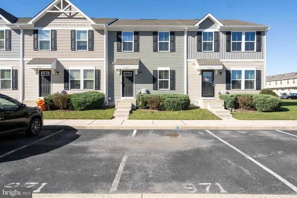 a view of multiple houses with a street
