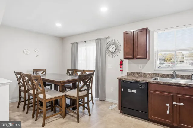 a kitchen with a table and chairs in it