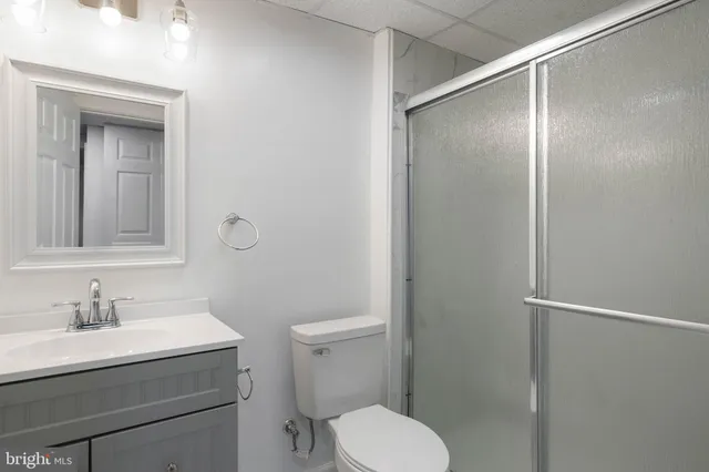 a kitchen with granite countertop a stove and a refrigerator
