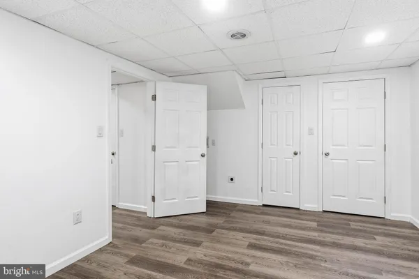 a bathroom with a black and white checkered floor