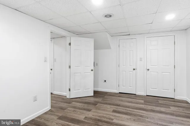 a bathroom with a black and white checkered floor