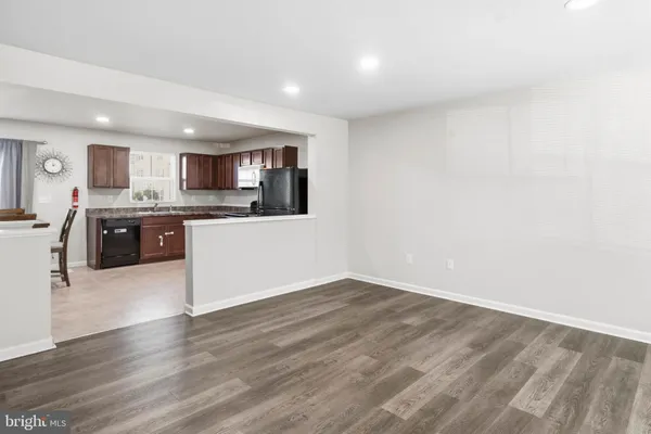 a view of kitchen with wooden floor
