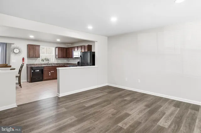 a view of kitchen with wooden floor
