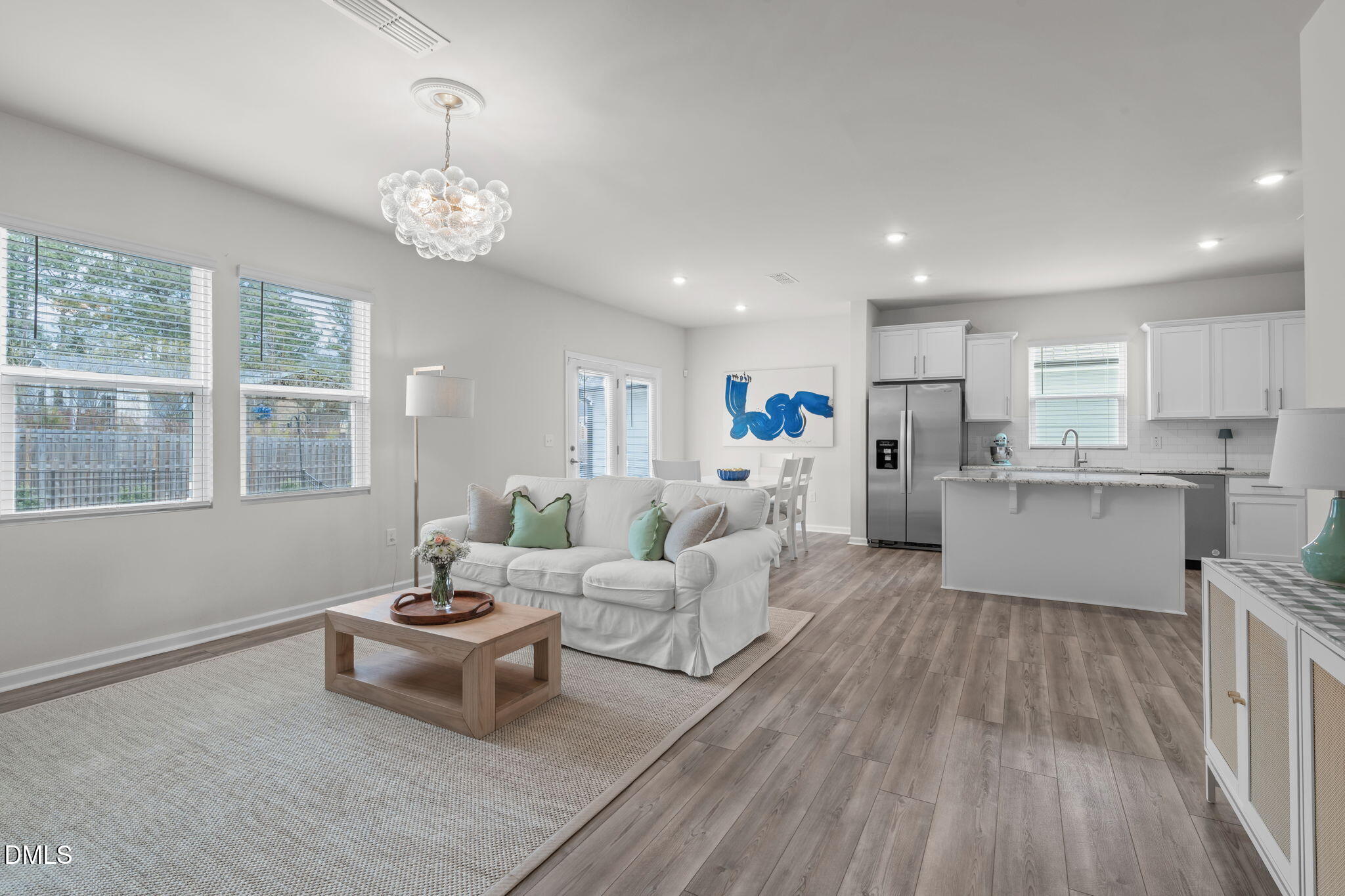481 Campbell Rdg Place Wendell, NC 27591 - Photo 6 of 46 An abundance of brighness from the recessed lighting, windows, and custom light fixture.