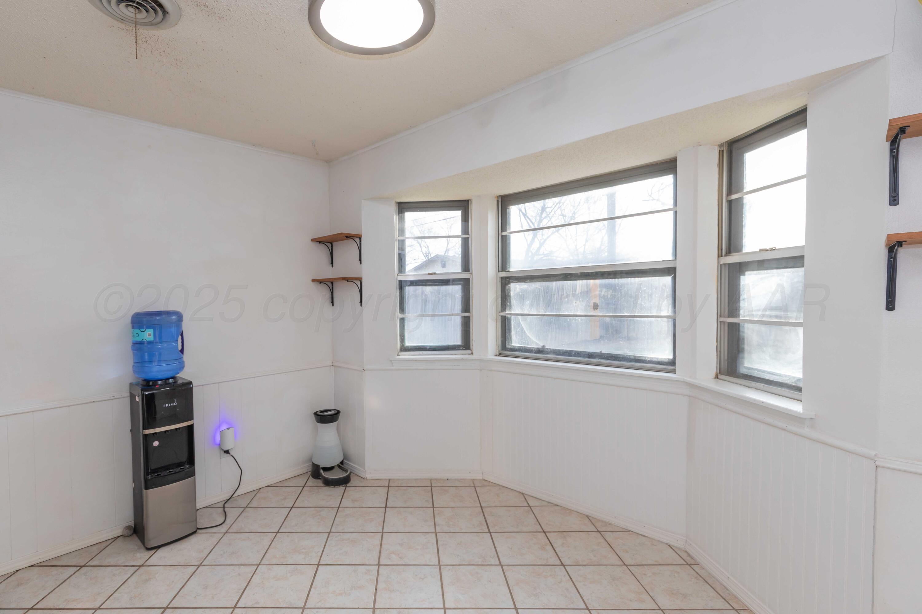 5301 Leigh Avenue Amarillo, TX 79110 - Photo 14 of 35 a view of an empty room with a window